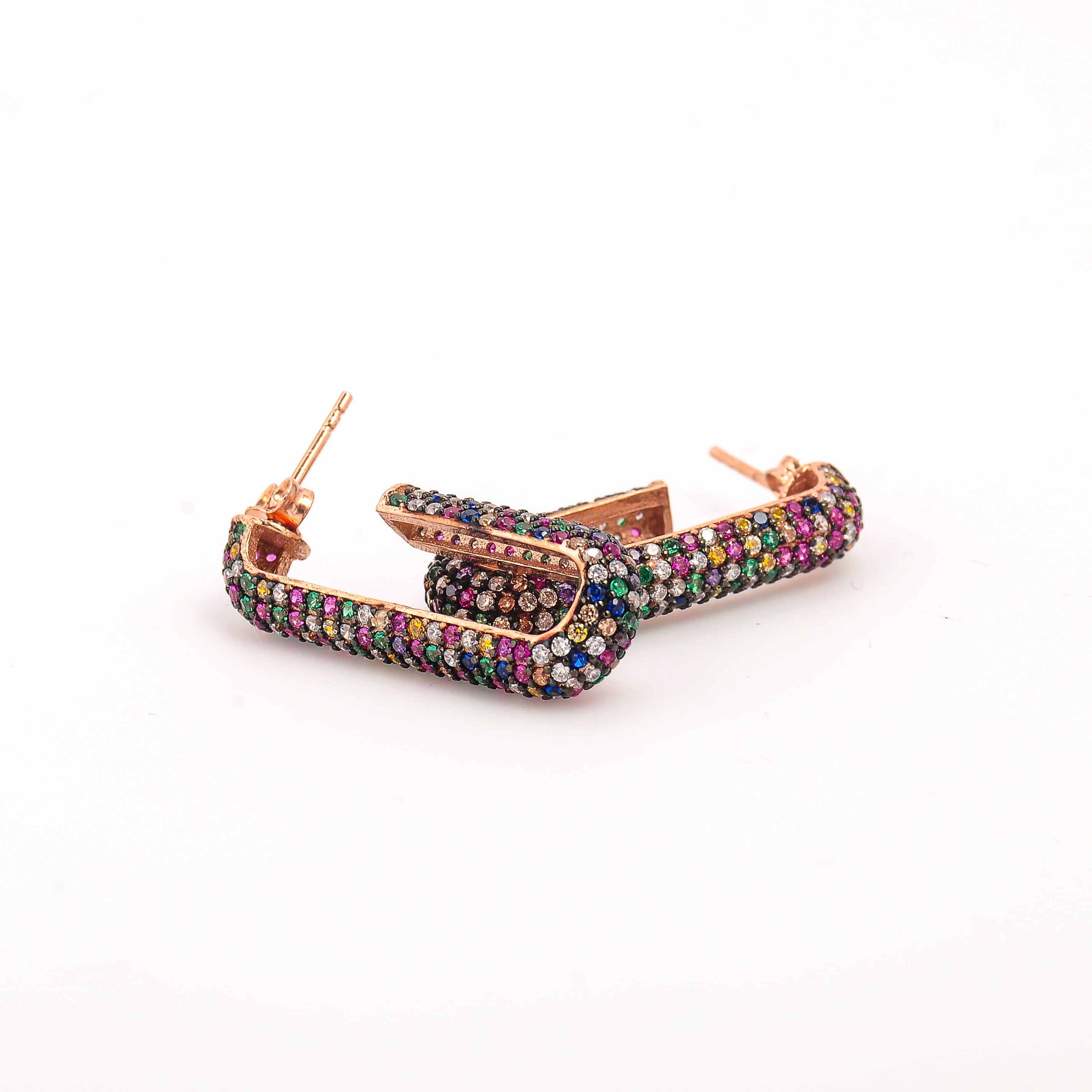 Multicolored hoop earrings on a white background