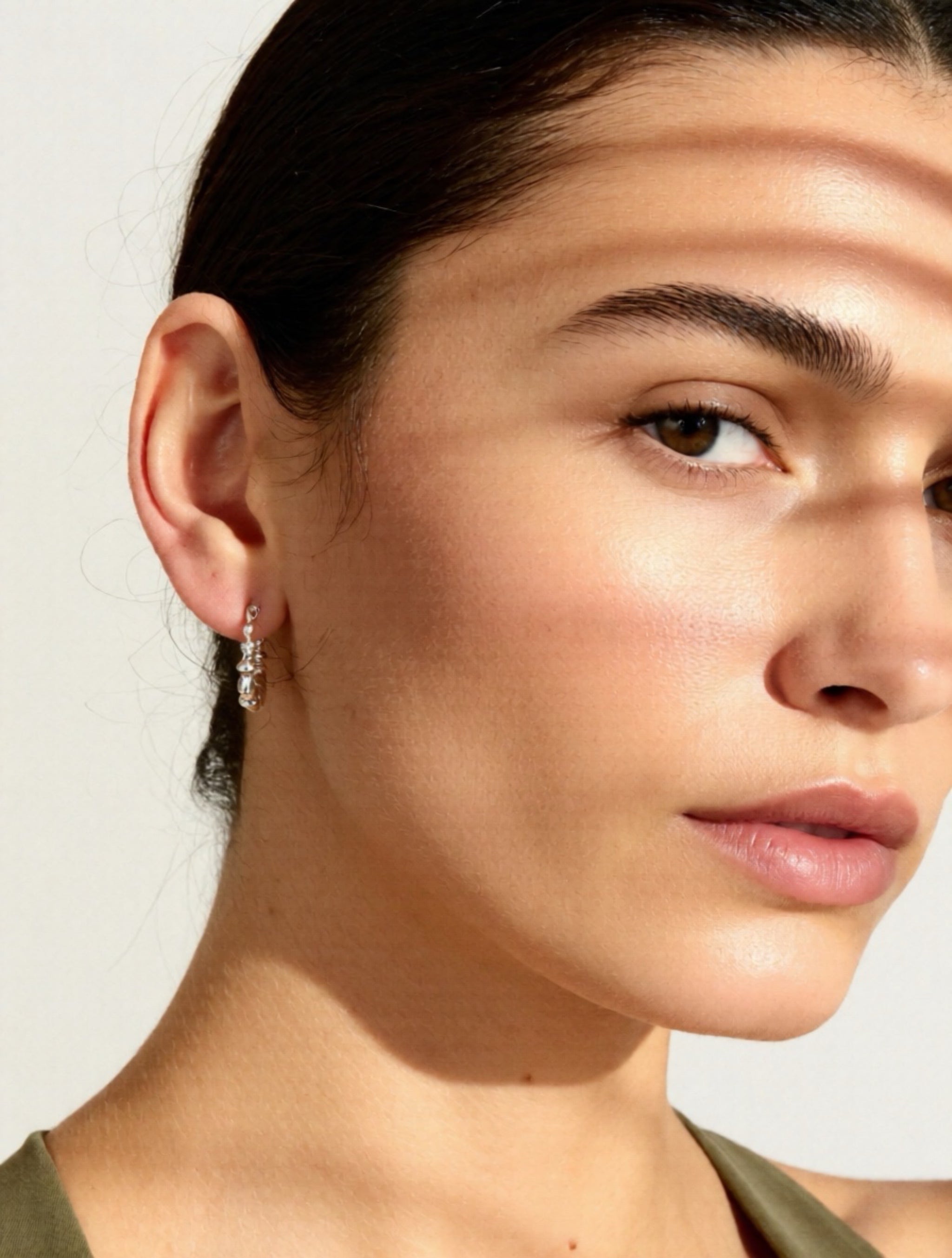 Close-up of a woman's face with a neutral background