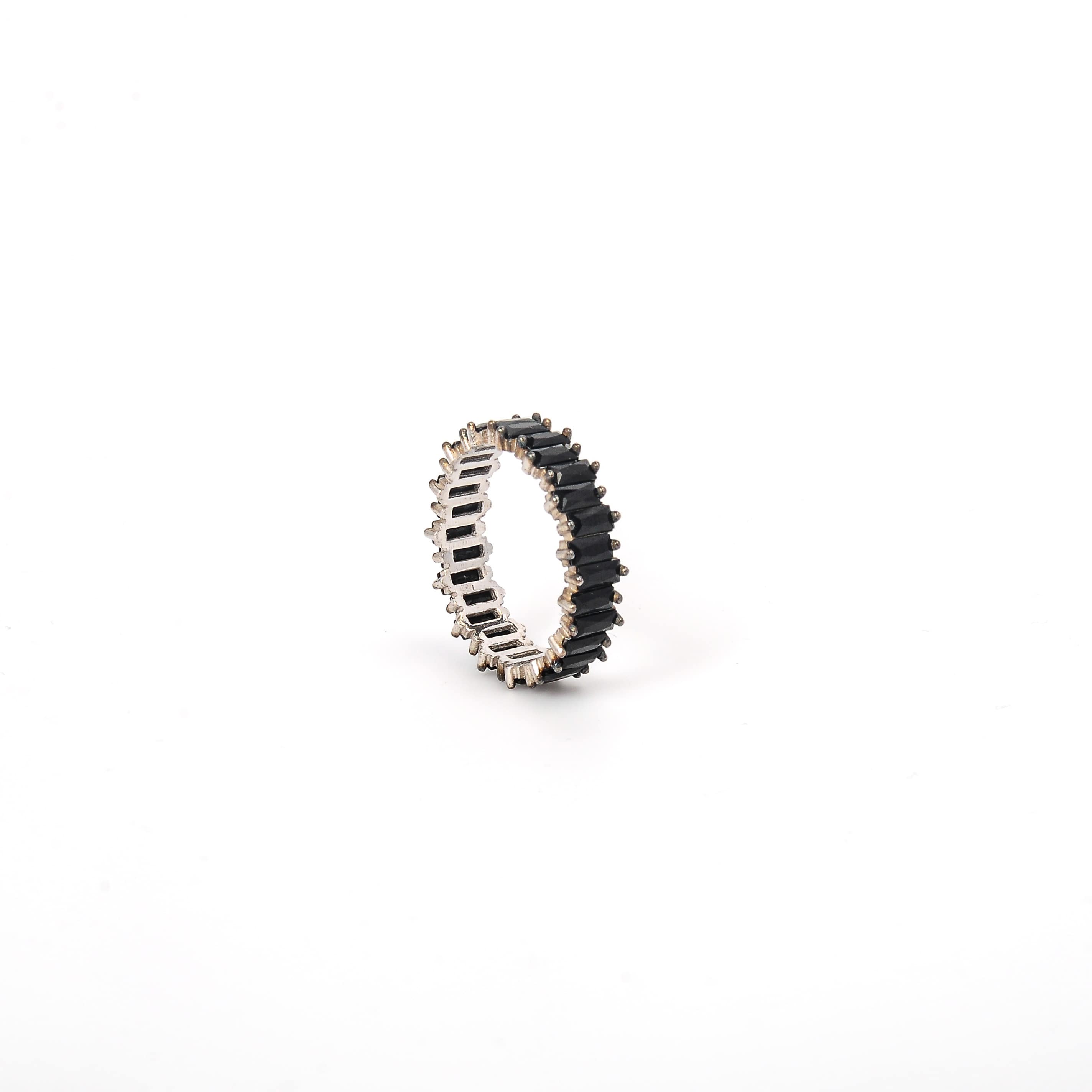Ring with black and silver design on a white background
