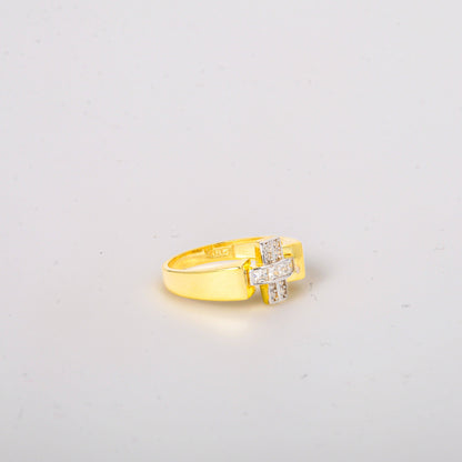 Gold ring with a diamond on a light gray background