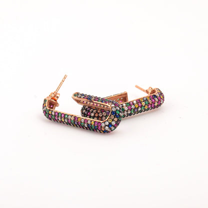 Multicolored hoop earrings on a white background
